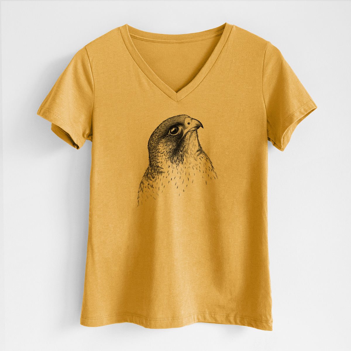 Honeycomb yellow women's relaxed fit cotton V-neck t-shirt laid flat, printed with a detailed black ink portrait of a peregrine falcon's head.