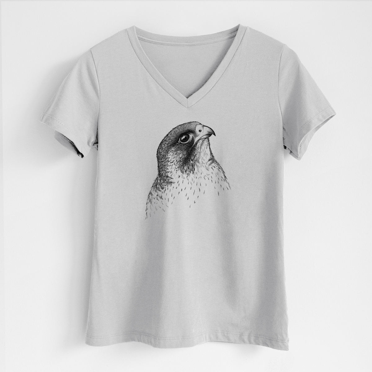 Lunar grey women's relaxed fit cotton V-neck t-shirt laid flat, printed with a detailed black ink portrait of a peregrine falcon's head.