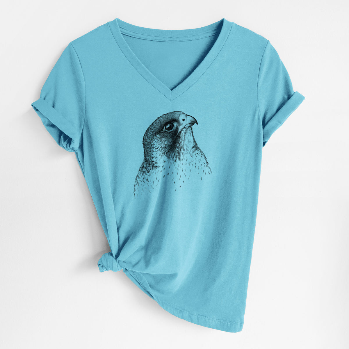 Turquoise women's relaxed fit cotton V-neck t-shirt laid flat, printed with a detailed black ink portrait of a peregrine falcon's head.
