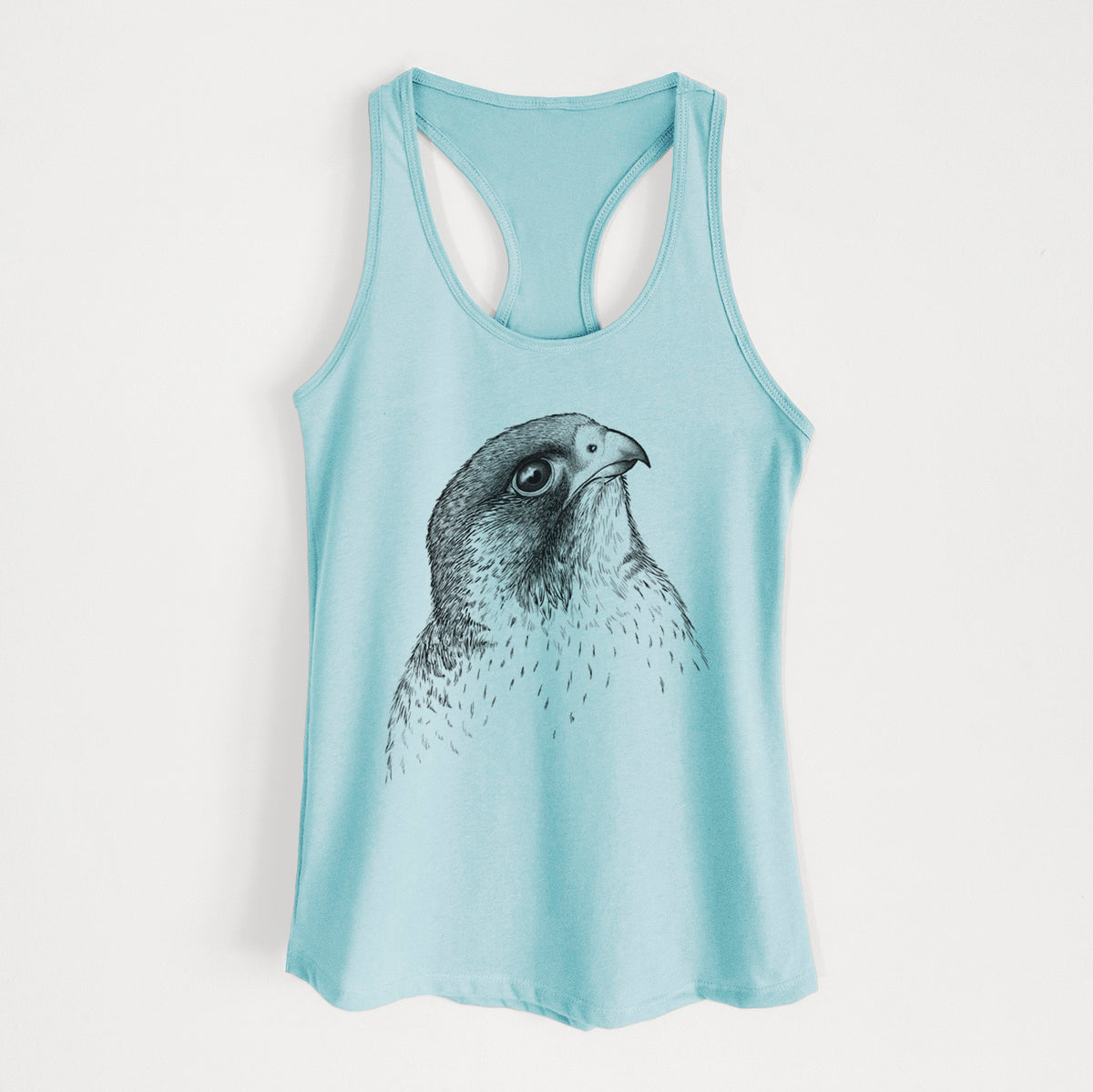 Cancun blue women's racerback tank top laid flat, printed with a detailed black ink portrait of a peregrine falcon's head.