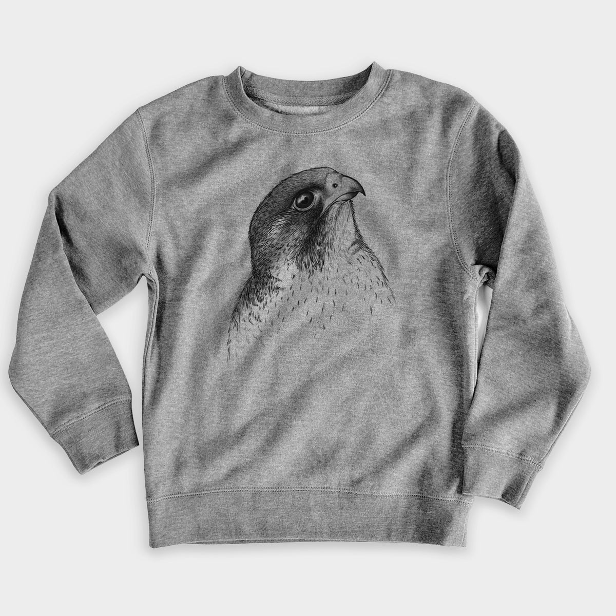 Nickel grey youth crewneck sweatshirt laid flat, printed with a detailed black ink portrait of a peregrine falcon's head.