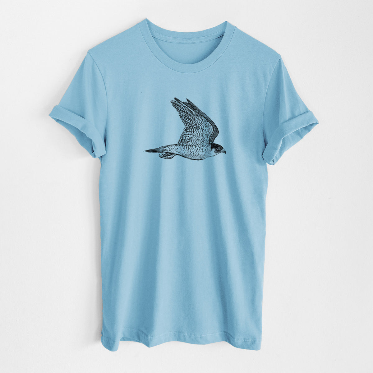 Ocean blue lightweight cotton t-shirt laid flat, printed with a detailed black ink illustration of a peregrine falcon in flight.