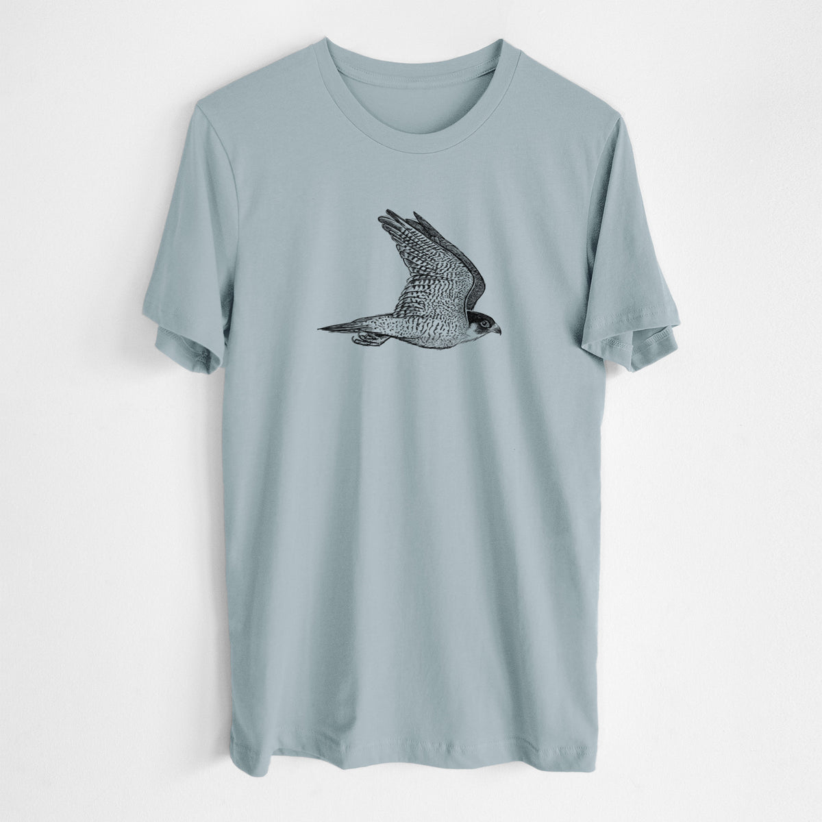 Vintage denim lightweight cotton t-shirt laid flat, printed with a detailed black ink illustration of a peregrine falcon in flight.