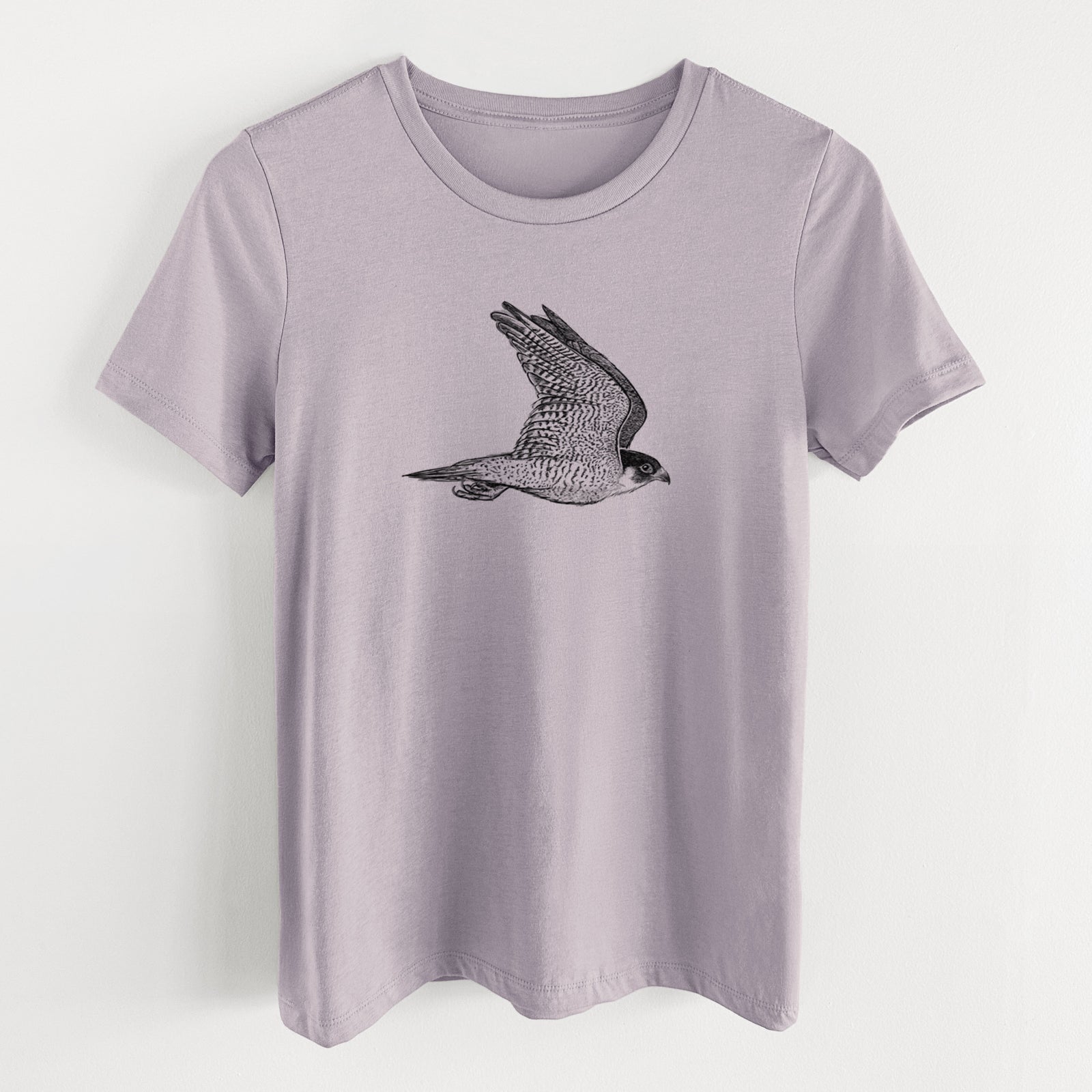 Light violet women's relaxed fit cotton t-shirt laid flat, printed with a detailed black ink illustration of a peregrine falcon in flight.