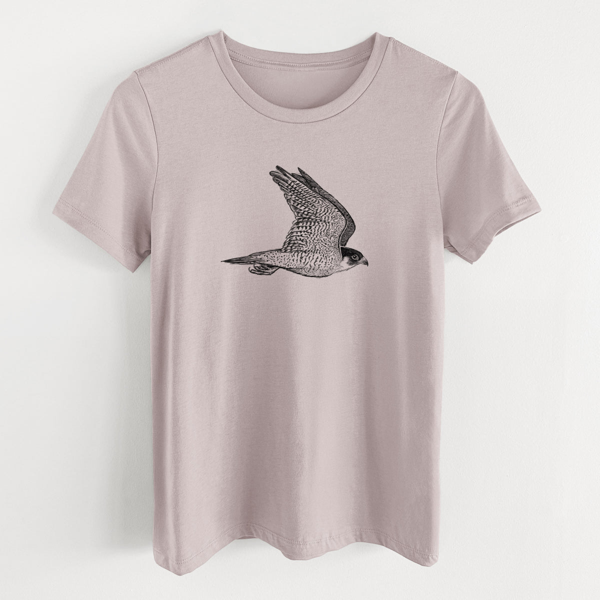 Pink gravel women's relaxed fit cotton t-shirt laid flat, printed with a detailed black ink illustration of a peregrine falcon in flight.