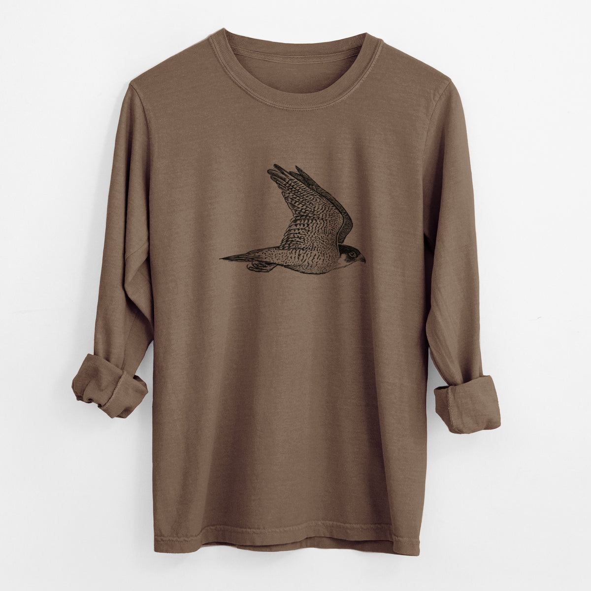 Espresso brown Comfort Colors long sleeve shirt laid flat with the cuffs rolled, printed with a detailed black ink illustration of a peregrine falcon in flight.