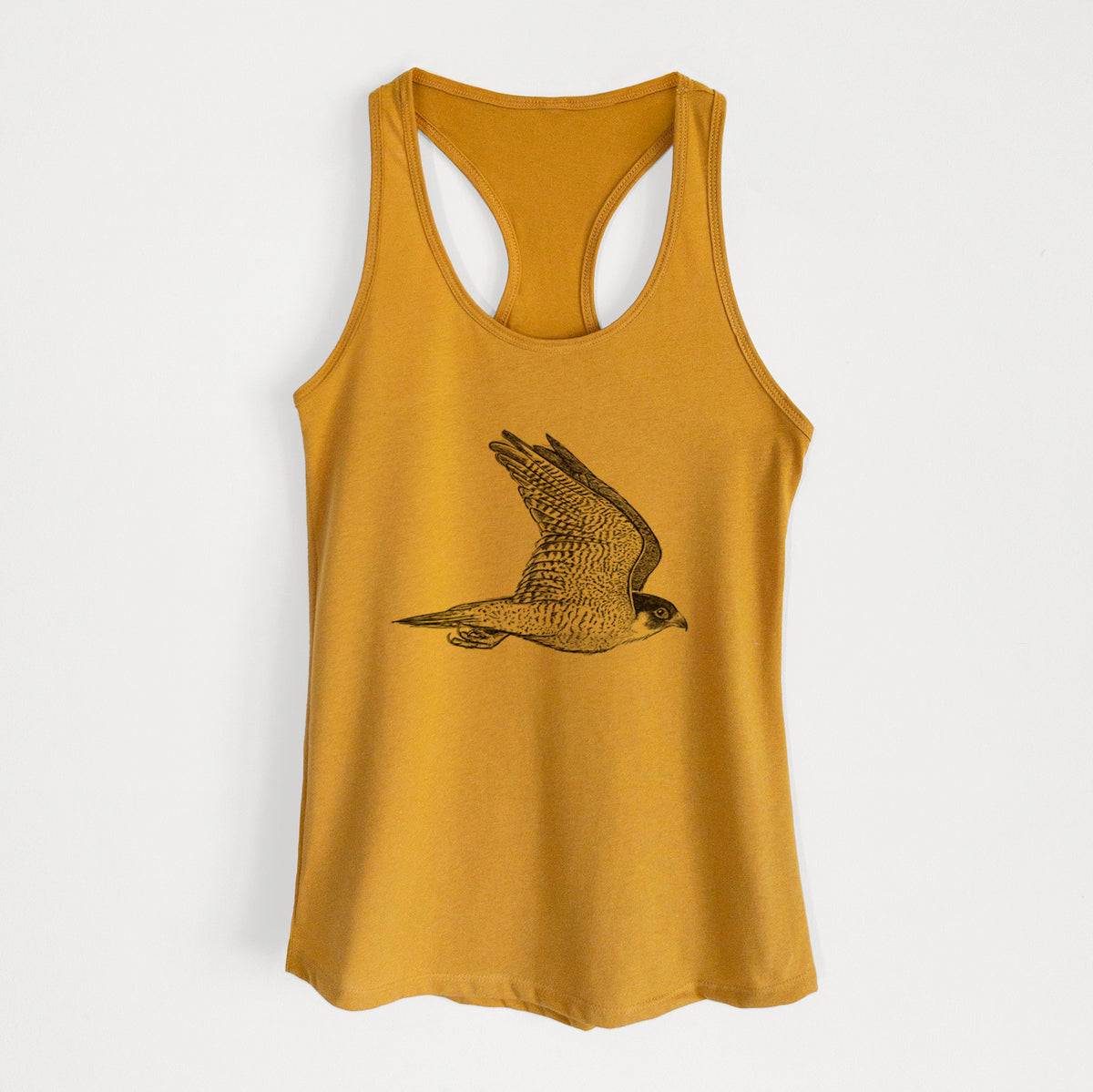 Gold women's racerback tank top laid flat, printed with a detailed black ink illustration of a peregrine falcon in flight.