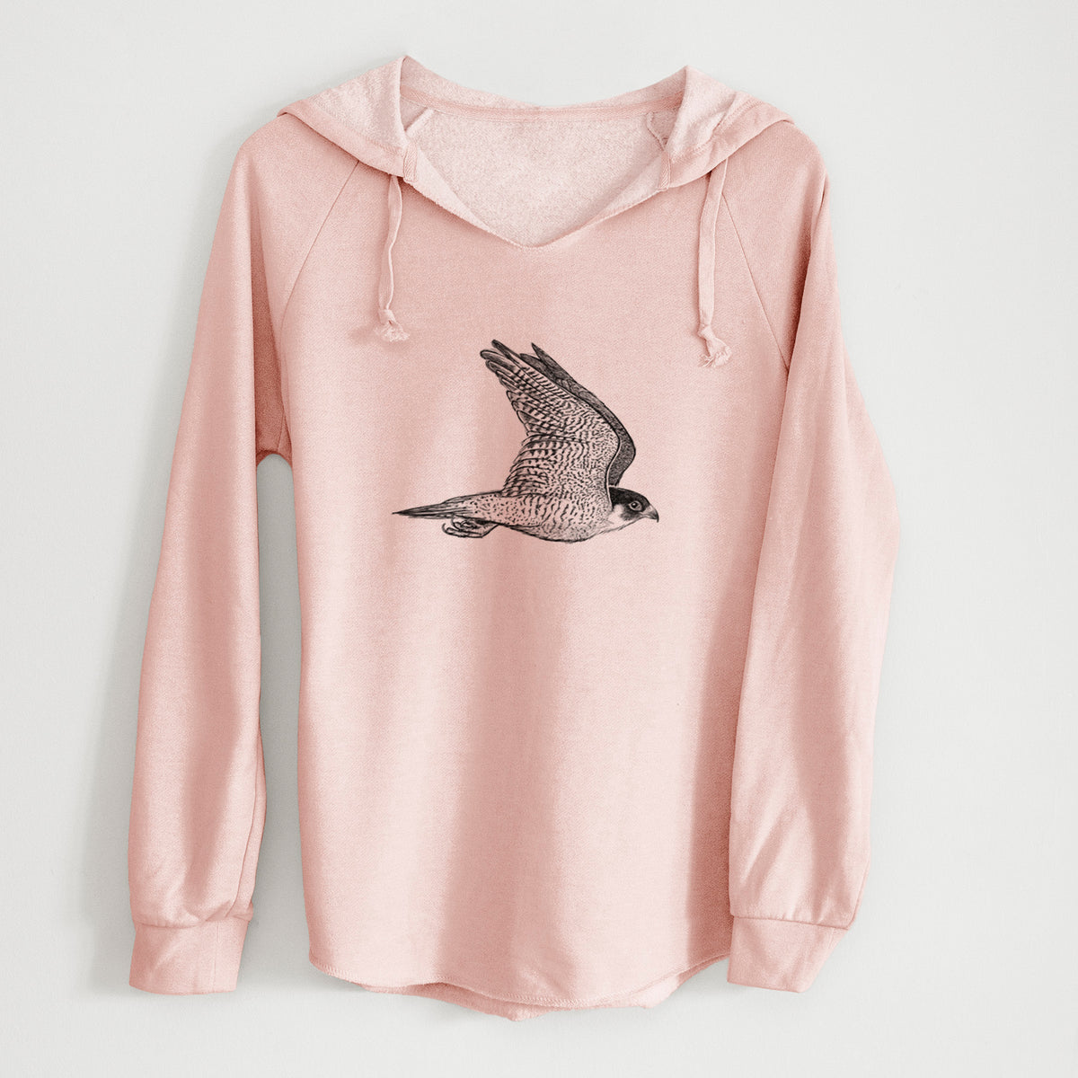 Blush pink women's Cali Wave hooded sweatshirt laid flat, printed with a detailed black ink illustration of a peregrine falcon in flight.