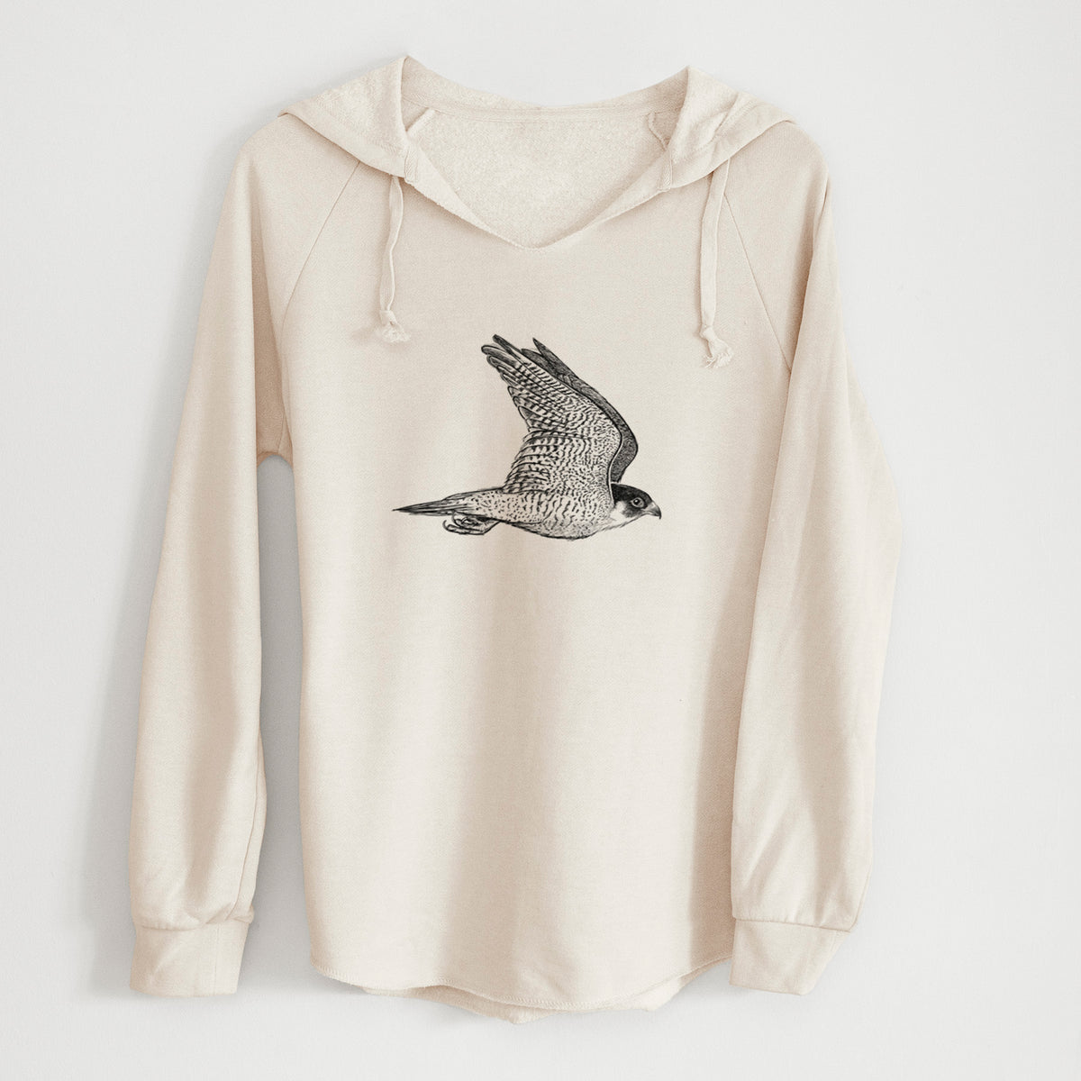 Bone cream women's Cali Wave hooded sweatshirt laid flat, printed with a detailed black ink illustration of a peregrine falcon in flight.
