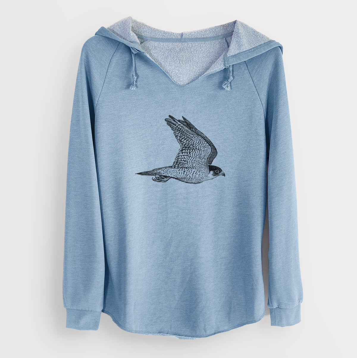 Misty blue women's Cali Wave hooded sweatshirt laid flat, printed with a detailed black ink illustration of a peregrine falcon in flight.