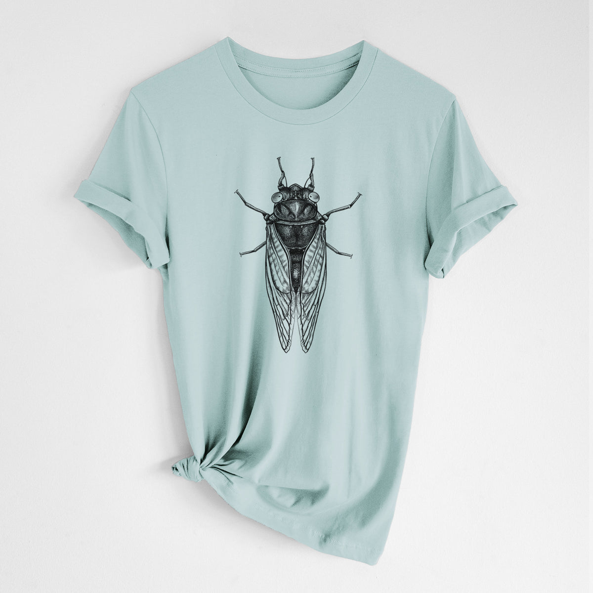 Dusty blue lightweight cotton t-shirt laid flat with the sleeves rolled, printed with a detailed black ink illustration of a periodical cicada with its wings folded, seen from above.