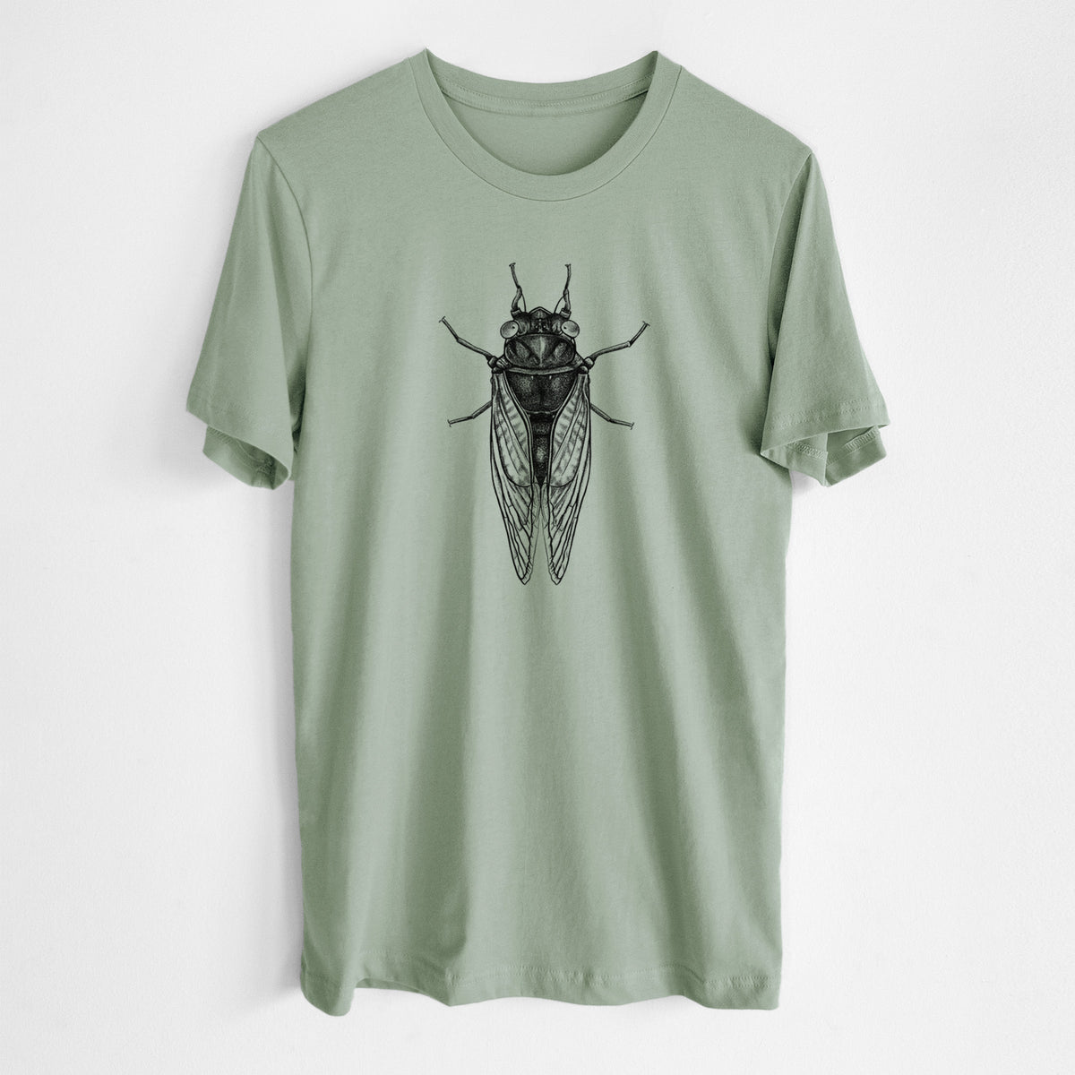 Sage green lightweight cotton t-shirt laid flat, printed with a detailed black ink illustration of a periodical cicada with its wings folded, seen from above.