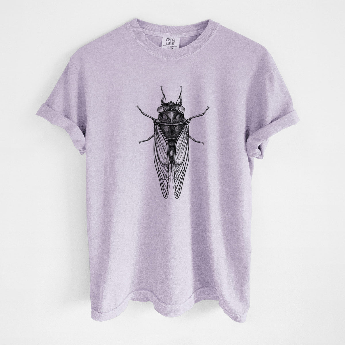 Orchid purple Comfort Colors t-shirt laid flat, printed with a detailed black ink illustration of a periodical cicada with its wings folded, seen from above.