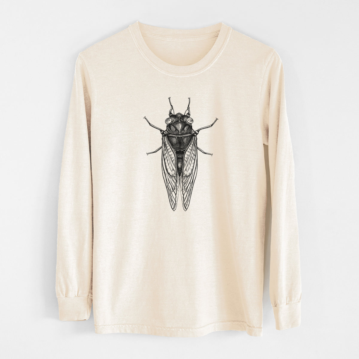 Ivory Comfort Colors long sleeve shirt laid flat, printed with a detailed black ink illustration of a periodical cicada with its wings folded, seen from above.