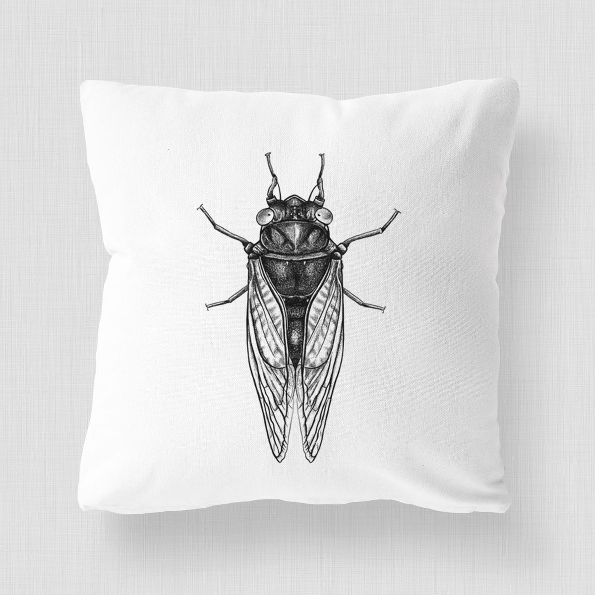 White pillow cover printed with a detailed black ink illustration of a periodical cicada with its wings folded, seen from above.
