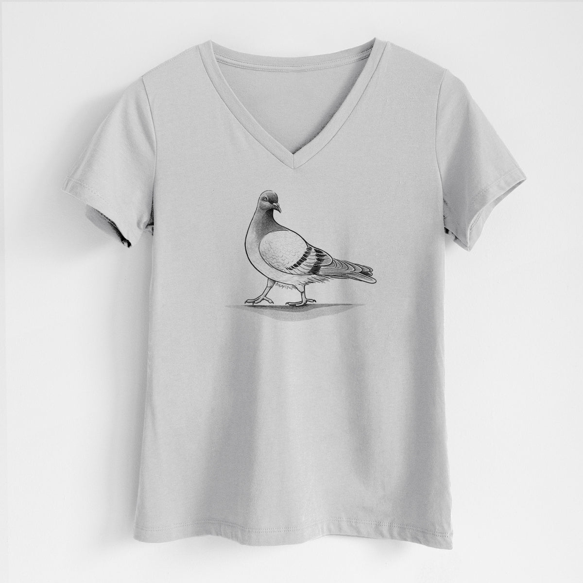 Lunar grey women's relaxed fit cotton V-neck t-shirt laid flat, printed with a black ink illustration of a pigeon standing.