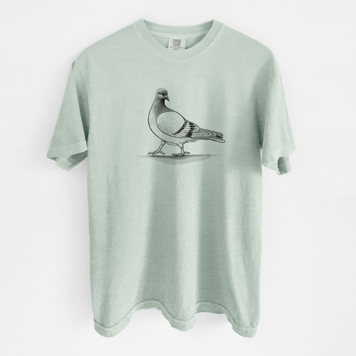 Bay green Comfort Colors t-shirt laid flat, printed with a black ink illustration of a pigeon standing.