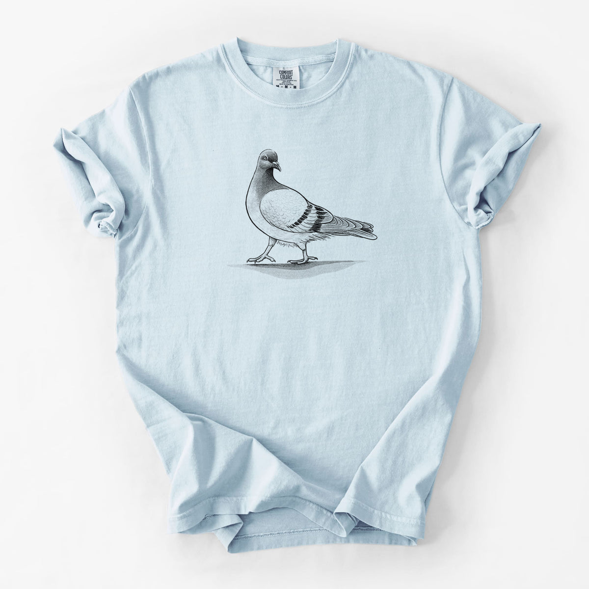 Chambray blue Comfort Colors t-shirt laid flat, printed with a black ink illustration of a pigeon standing.