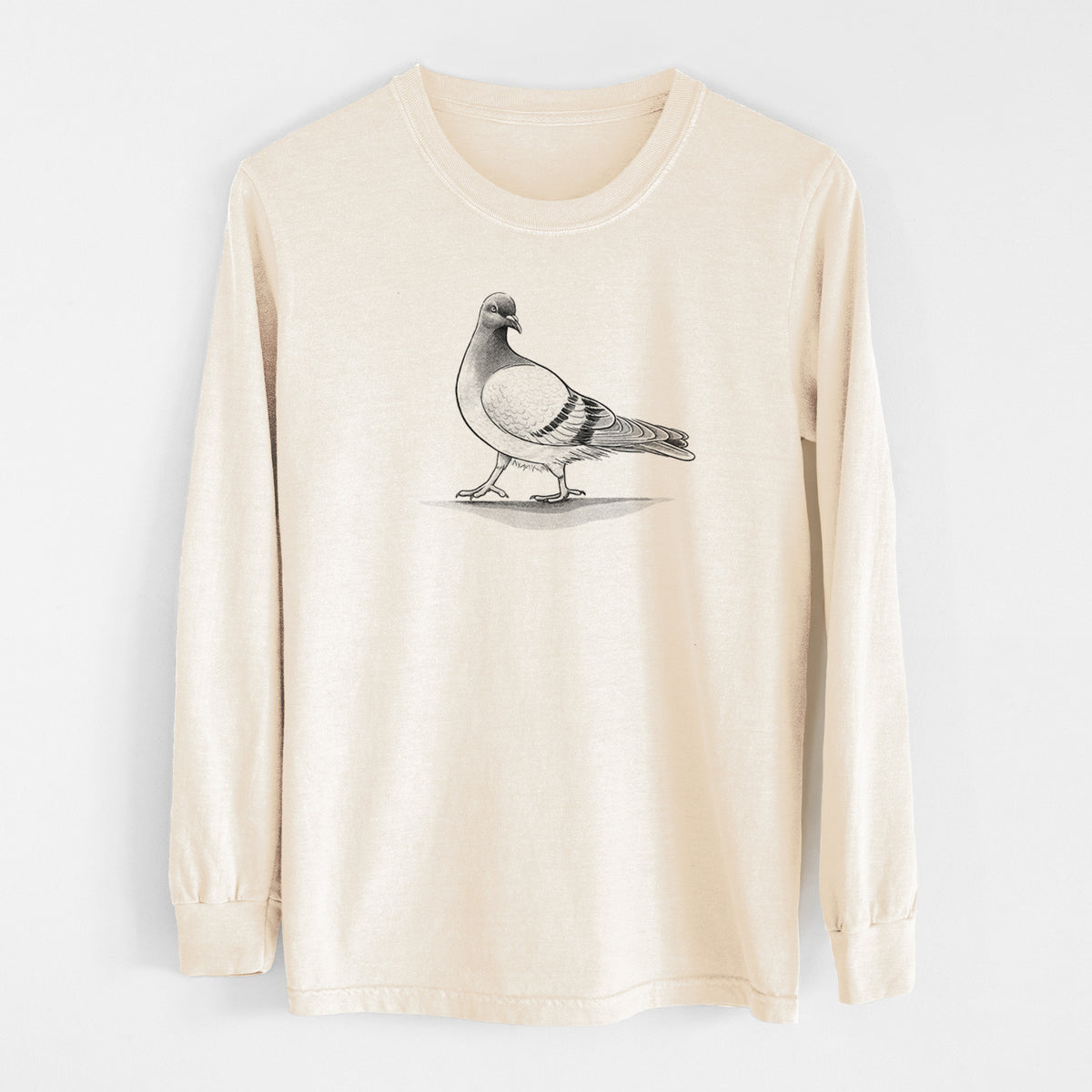 Ivory Comfort Colors long sleeve shirt laid flat, printed with a black ink illustration of a pigeon standing.
