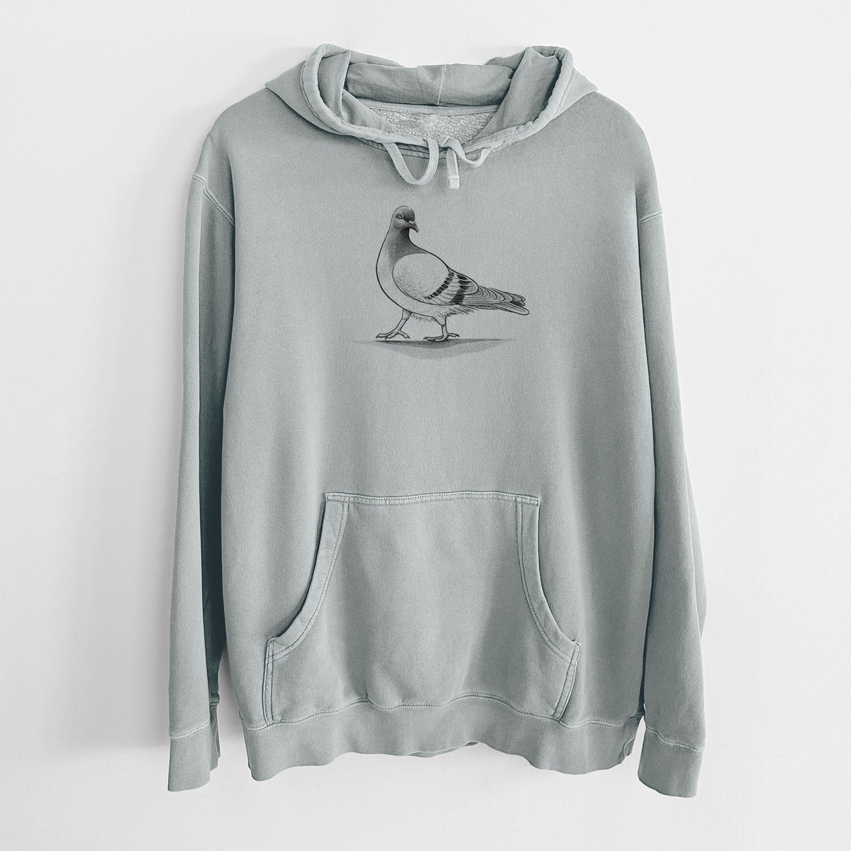 Sage green pigment dyed hoodie laid flat, printed with a black ink illustration of a pigeon standing.