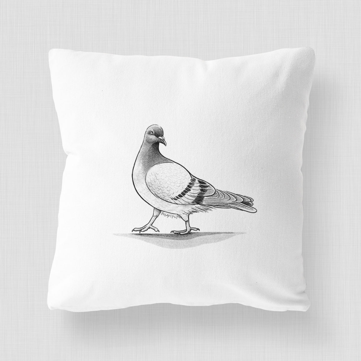White pillow cover printed with a black ink illustration of a pigeon standing.