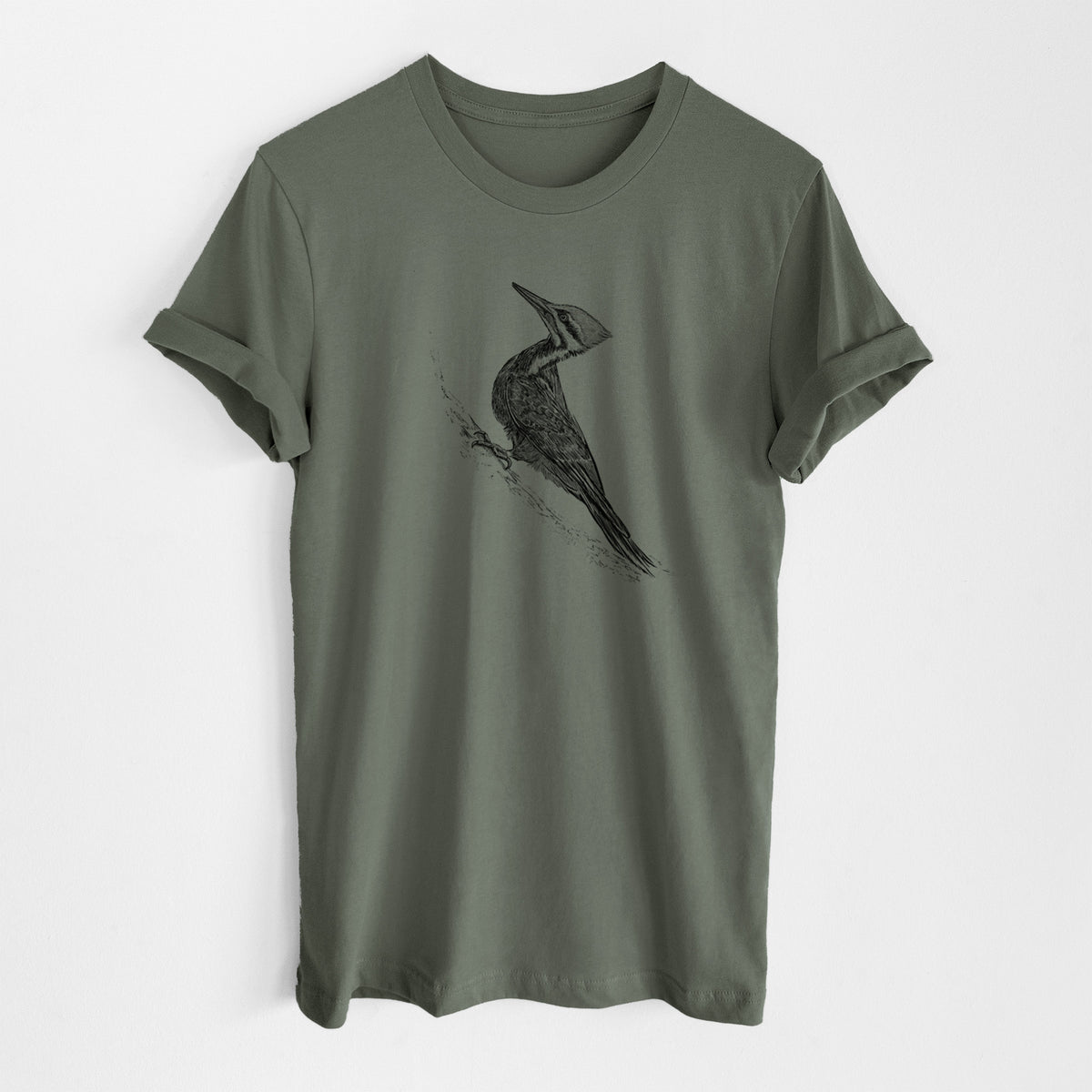 Military green lightweight cotton t-shirt laid flat, printed with a black ink illustration of a pileated woodpecker clinging to a tree trunk.