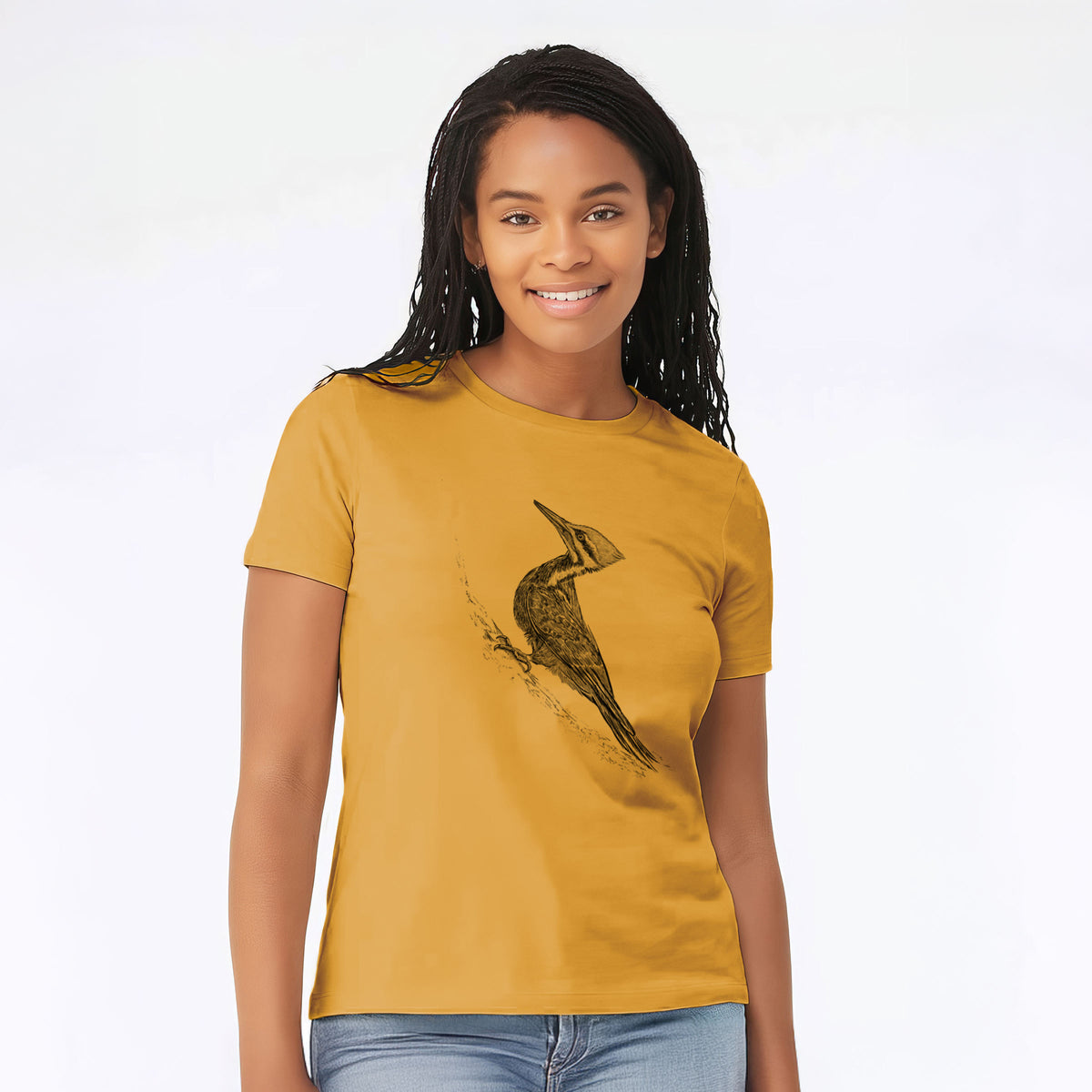 Woman wearing a mustard yellow women's relaxed fit cotton t-shirt printed with a black ink illustration of a pileated woodpecker clinging to a tree trunk.
