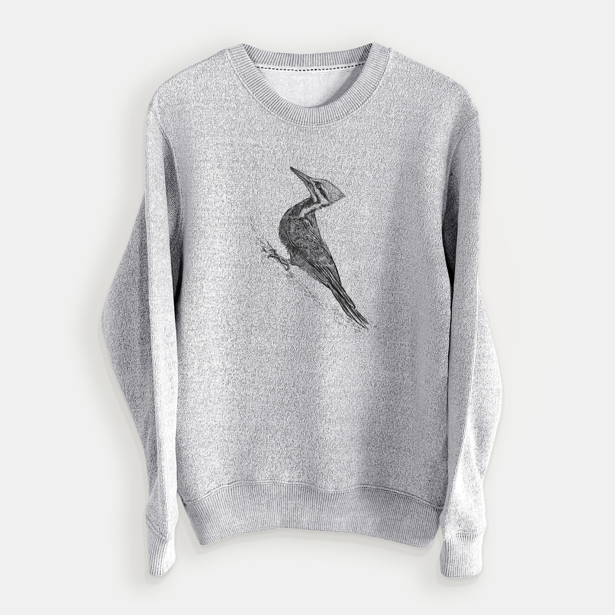 Salt and pepper knit sweatshirt laid flat, printed with a black ink illustration of a pileated woodpecker clinging to a tree trunk.
