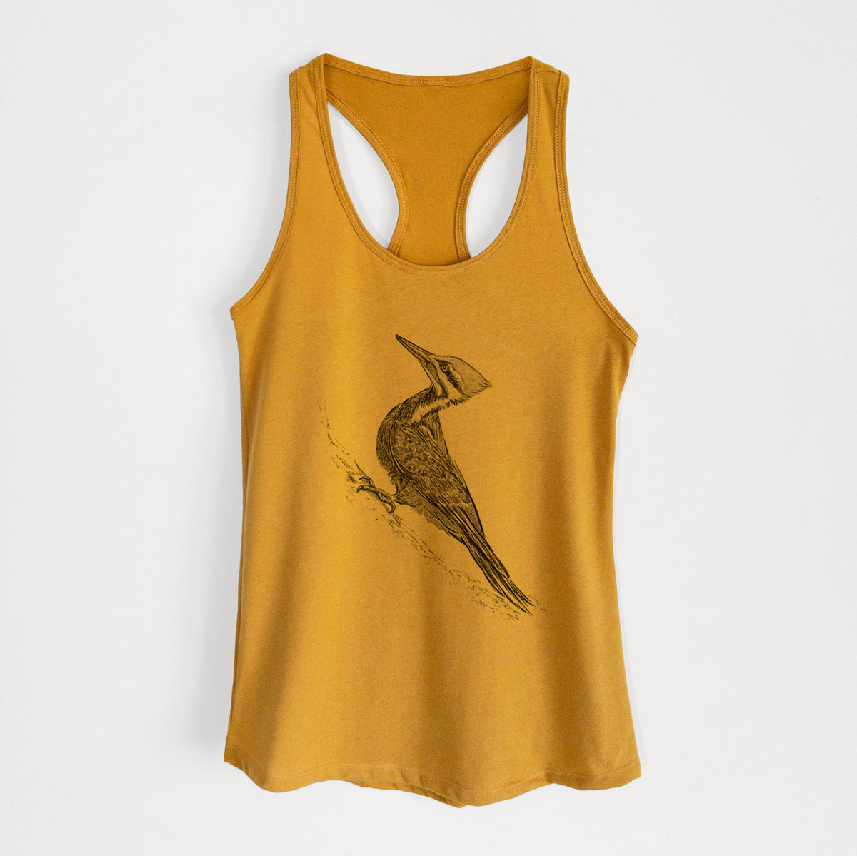 Gold women's racerback tank top laid flat, printed with a black ink illustration of a pileated woodpecker clinging to a tree trunk.
