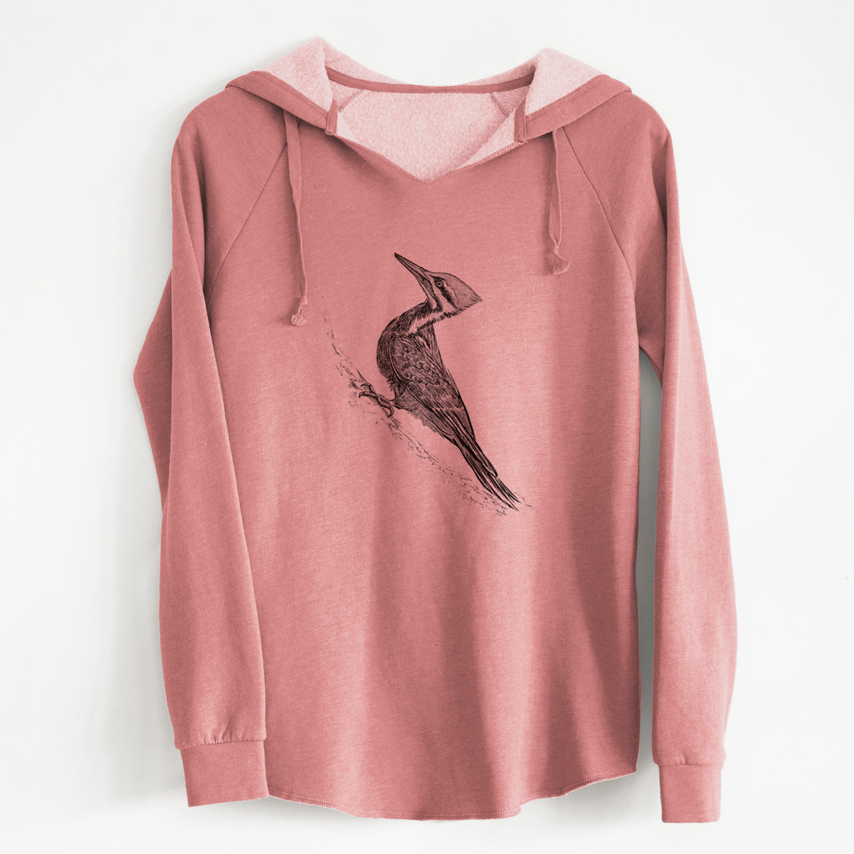 Dusty rose women's Cali Wave hooded sweatshirt laid flat, printed with a black ink illustration of a pileated woodpecker clinging to a tree trunk.