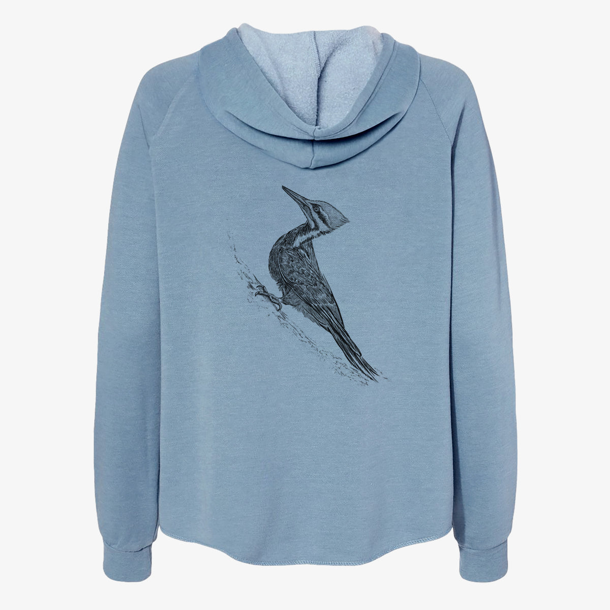 Misty blue women's Cali Wave zip-up sweatshirt laid flat, printed with a black ink illustration of a pileated woodpecker clinging to a tree trunk.