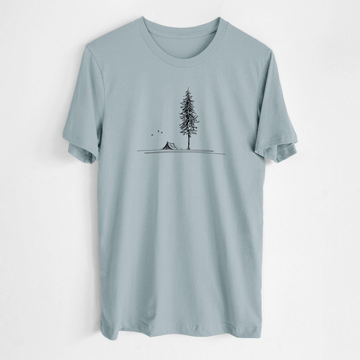 Vintage denim lightweight cotton t-shirt laid flat, printed with a black ink illustration of a tall pine tree beside a small tent on a hill.