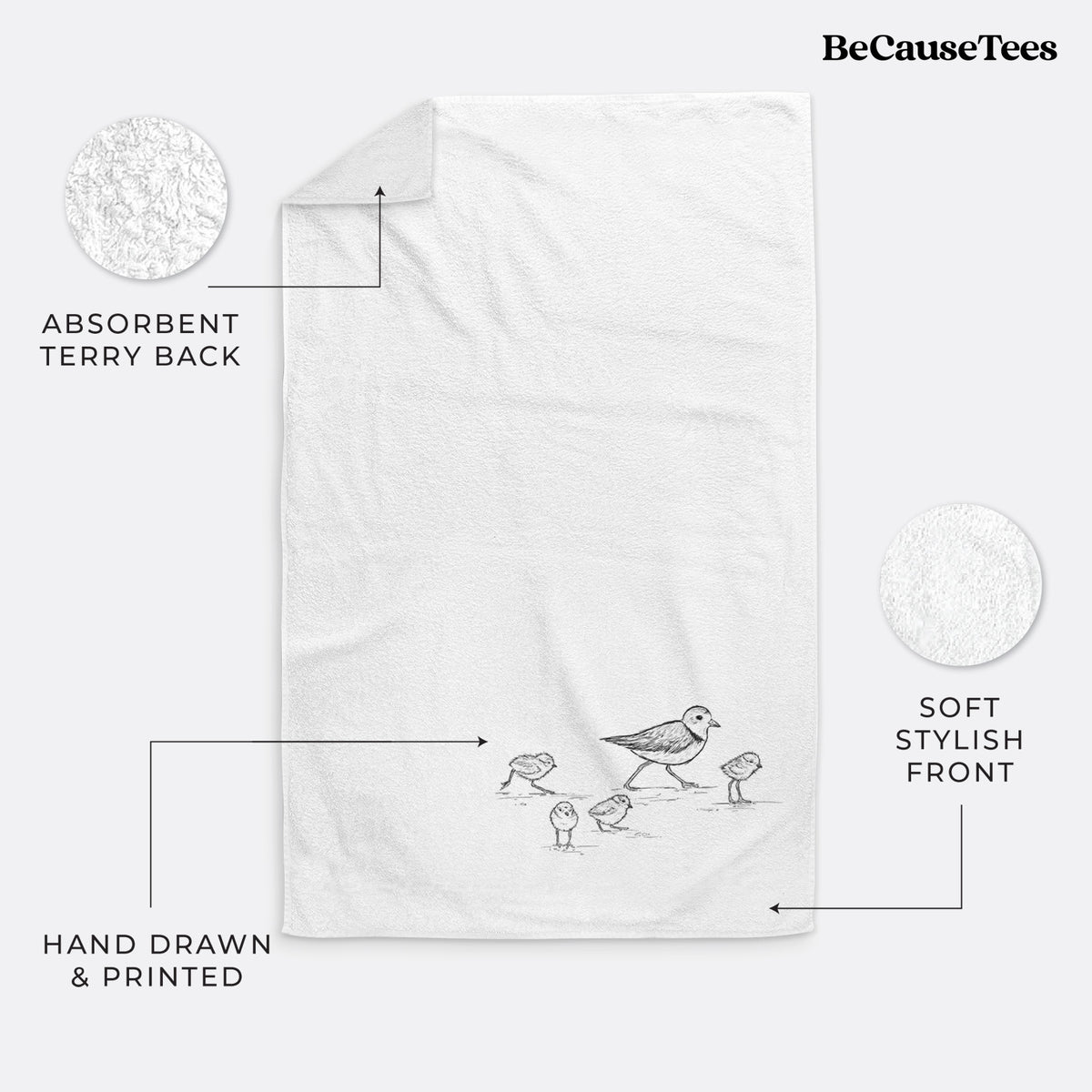 White hand towel printed with a black ink sketch of a piping plover with its chicks on the sand.