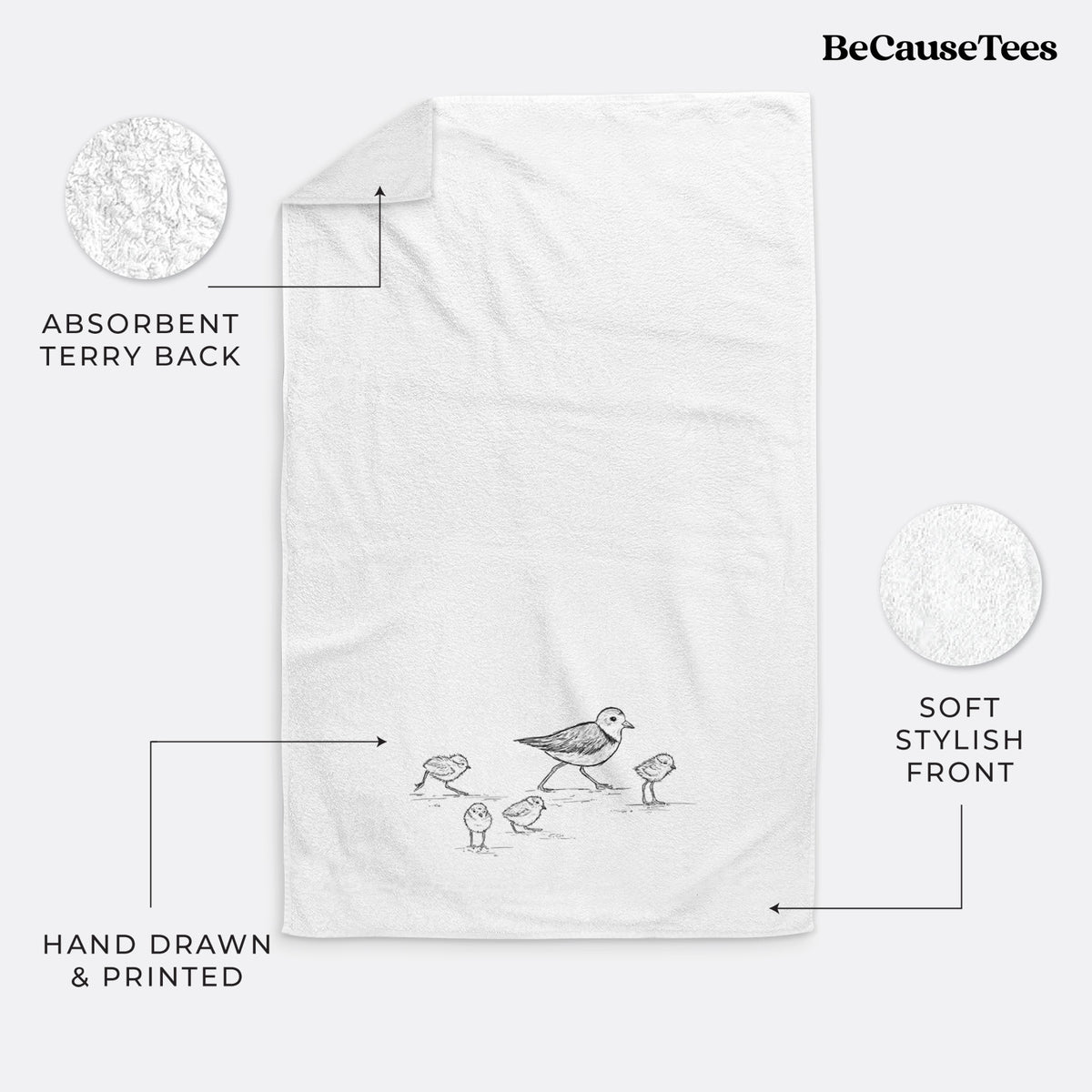 White hand towel printed with a black ink sketch of a piping plover with its chicks on the sand.