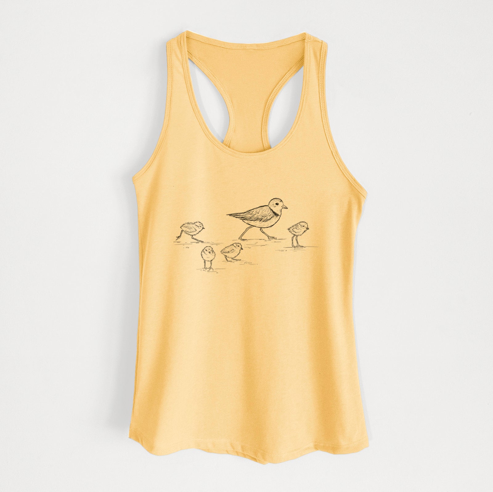 Banana cream women's racerback tank top laid flat, printed with a black ink sketch of a piping plover with its chicks on the sand.