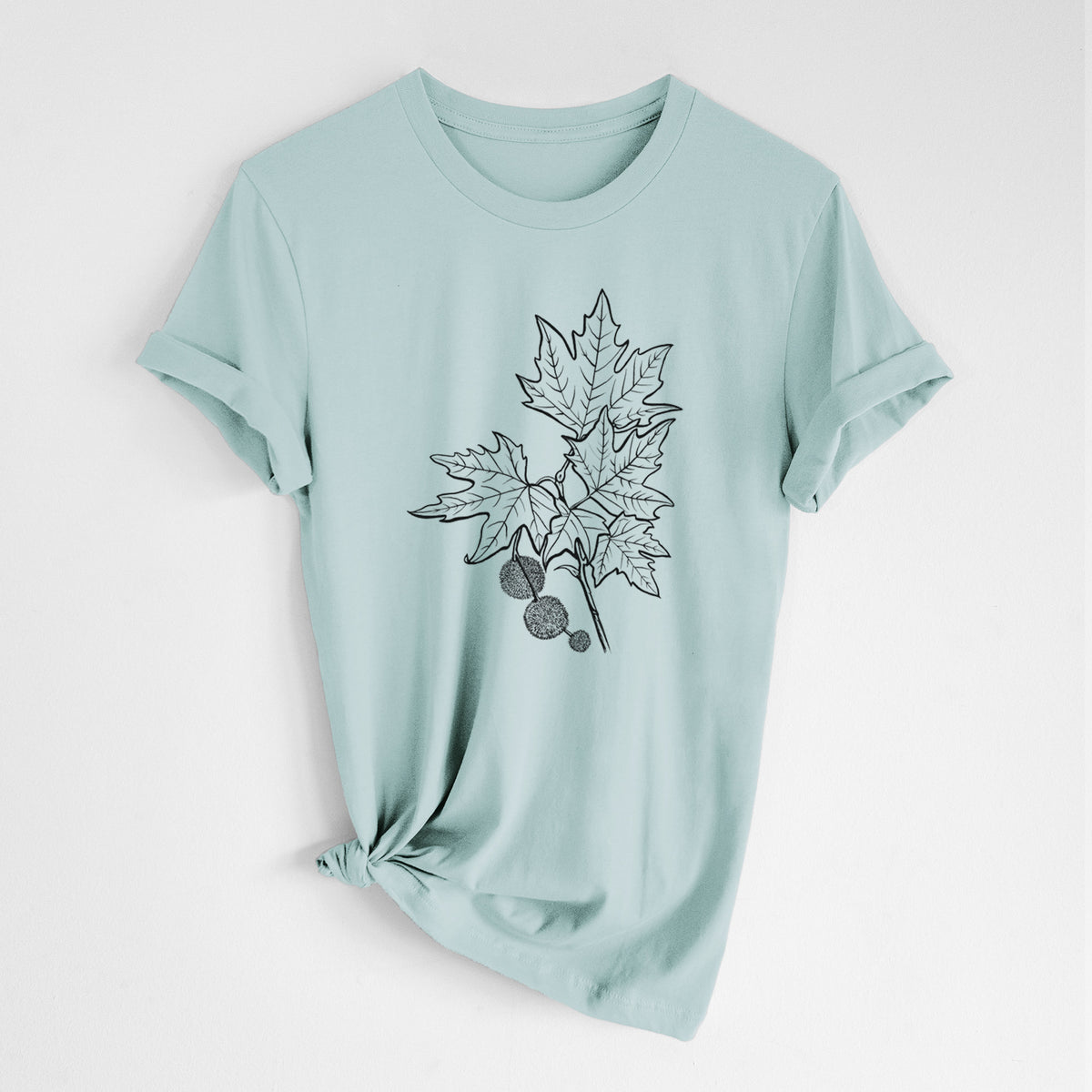 Dusty blue lightweight cotton t-shirt laid flat with the sleeves rolled, printed with a black ink illustration of an oriental plane tree branch with lobed leaves and round seed balls.