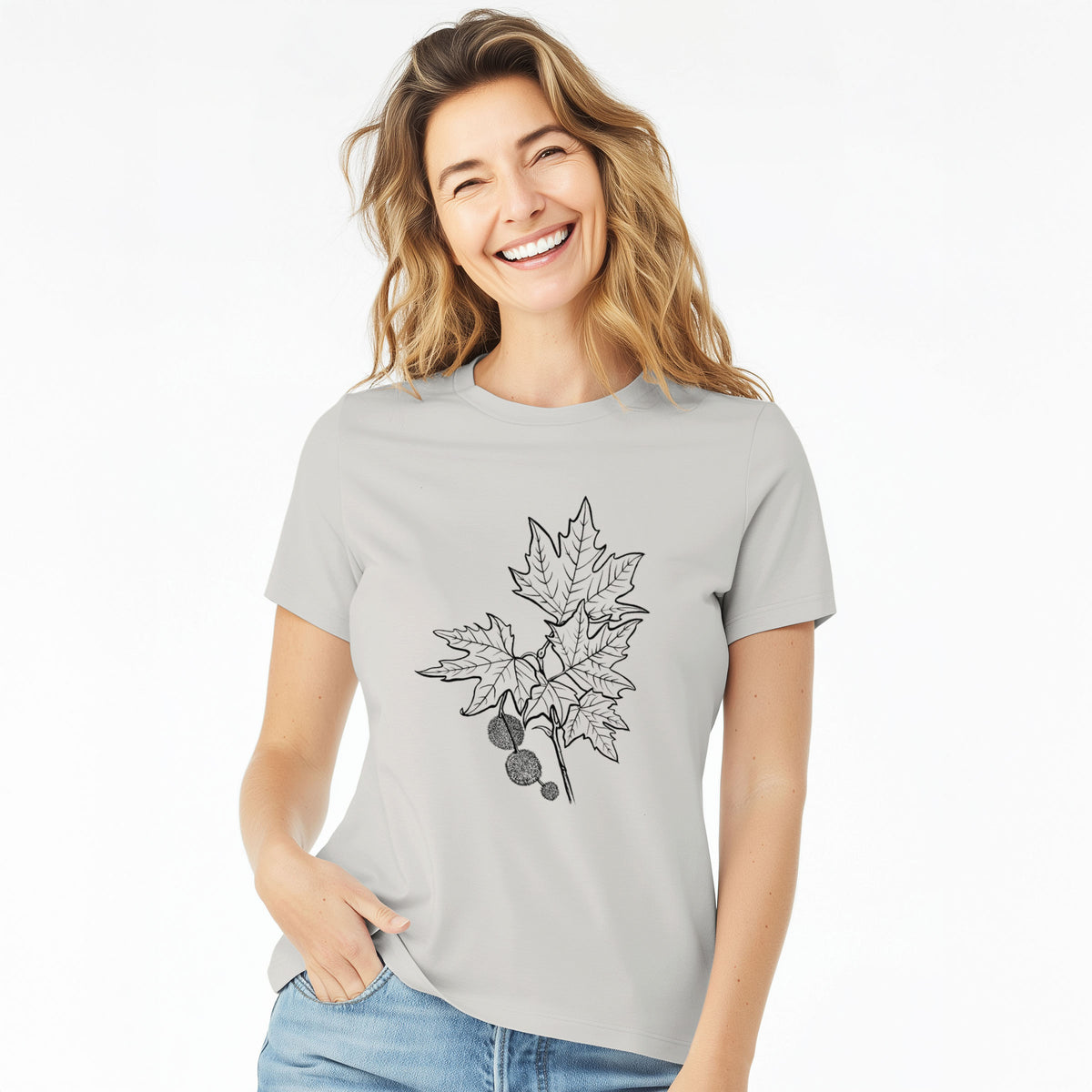 Woman wearing a lunar grey women's relaxed fit cotton t-shirt printed with a black ink illustration of an oriental plane tree branch with lobed leaves and round seed balls.