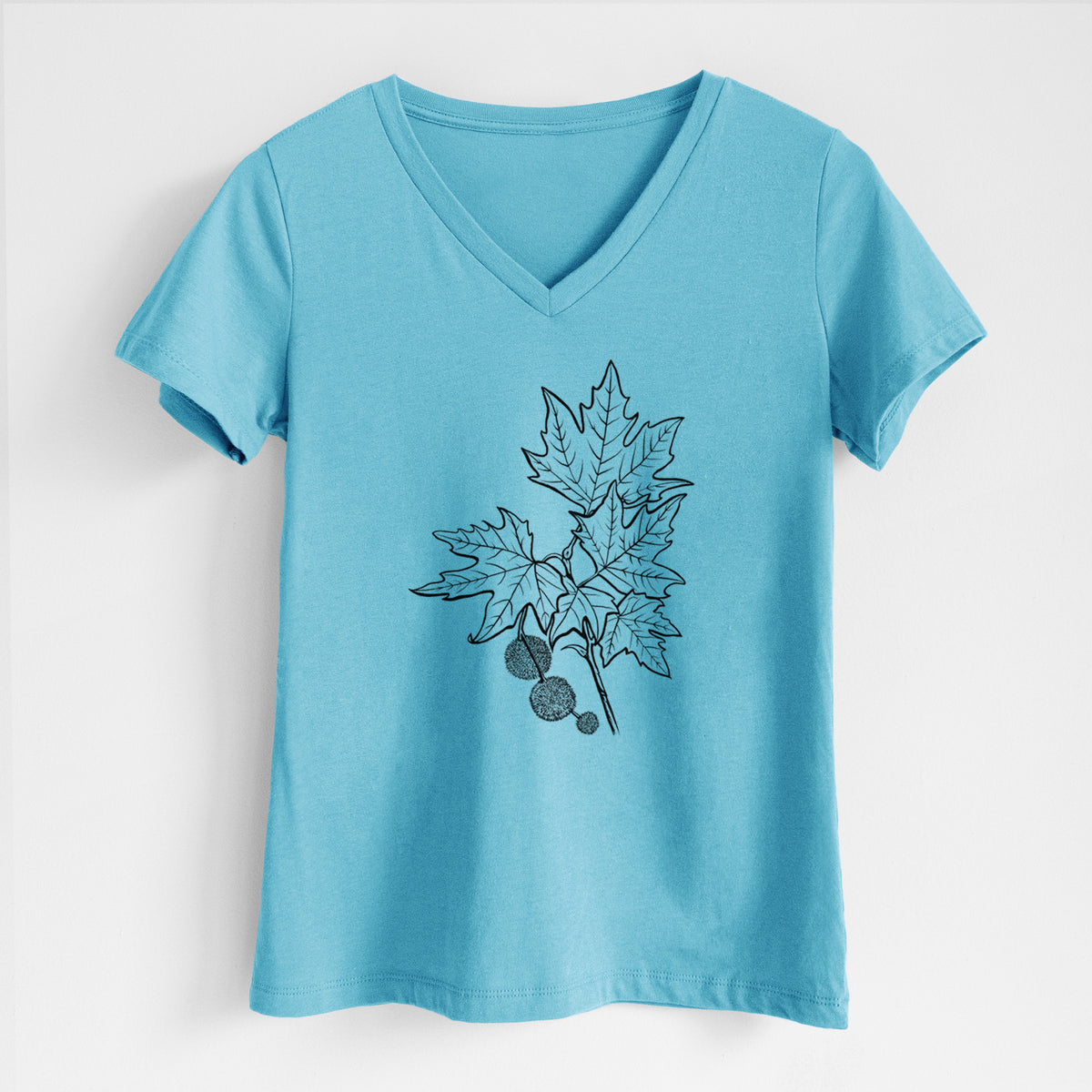 Turquoise women's relaxed fit cotton V-neck t-shirt laid flat, printed with a black ink illustration of an oriental plane tree branch with lobed leaves and round seed balls.