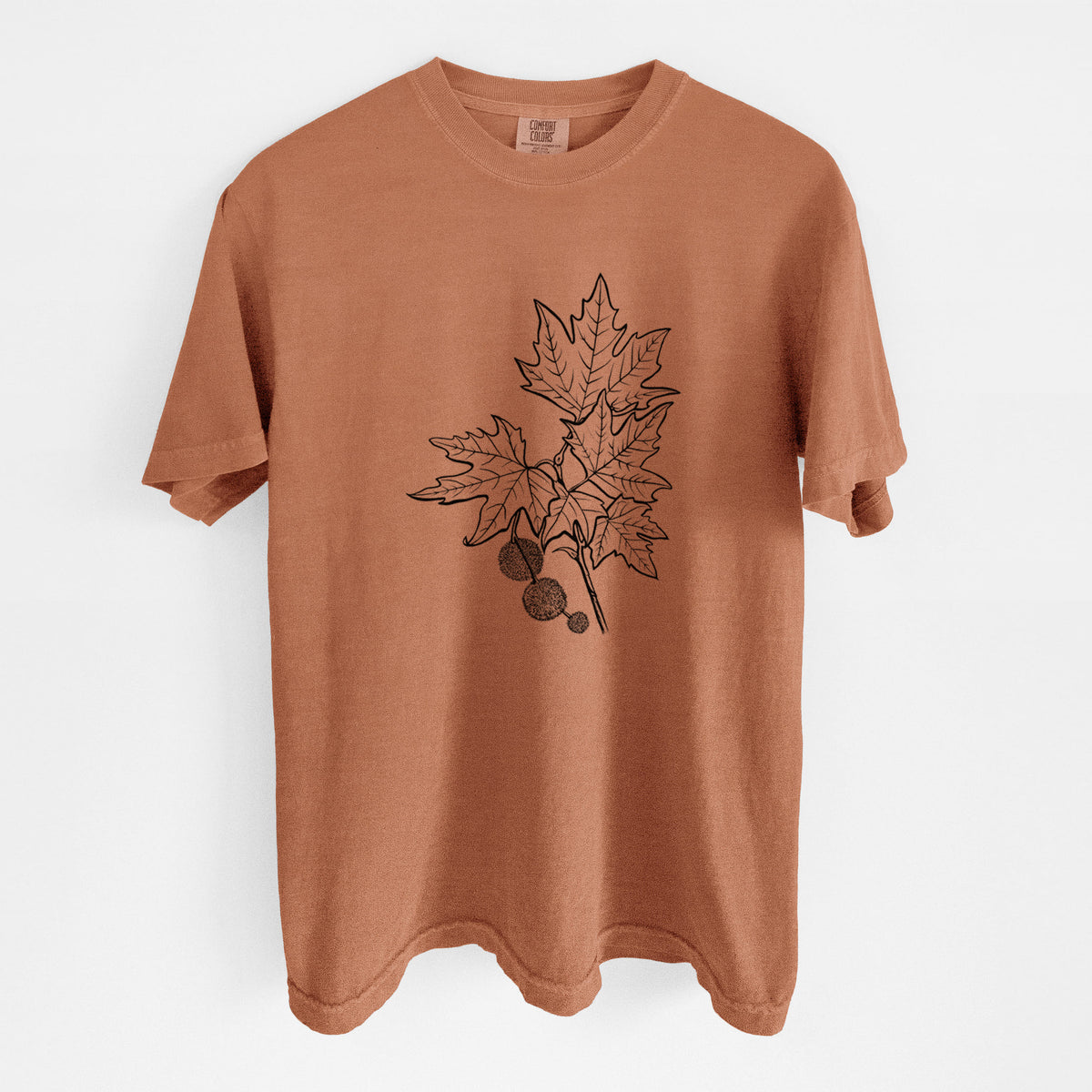 Yam burnt orange Comfort Colors t-shirt laid flat, printed with a black ink illustration of an oriental plane tree branch with lobed leaves and round seed balls.