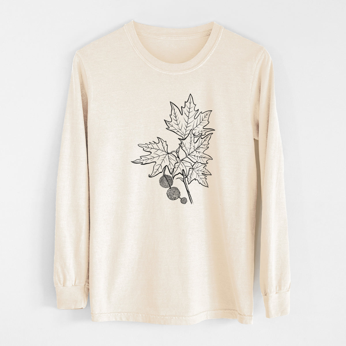 Ivory Comfort Colors long sleeve shirt laid flat, printed with a black ink illustration of an oriental plane tree branch with lobed leaves and round seed balls.