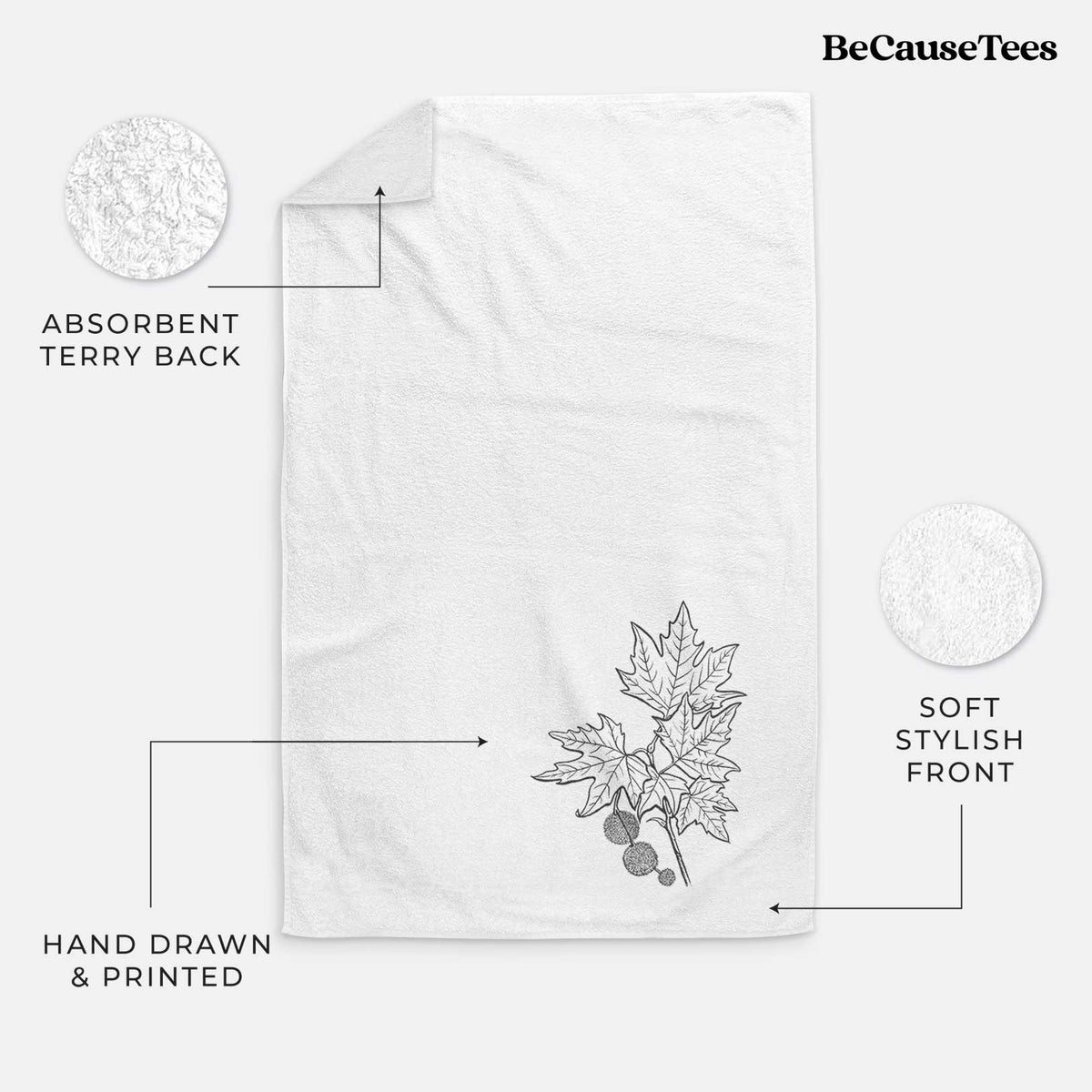 White hand towel printed with a black ink illustration of an oriental plane tree branch with lobed leaves and round seed balls.