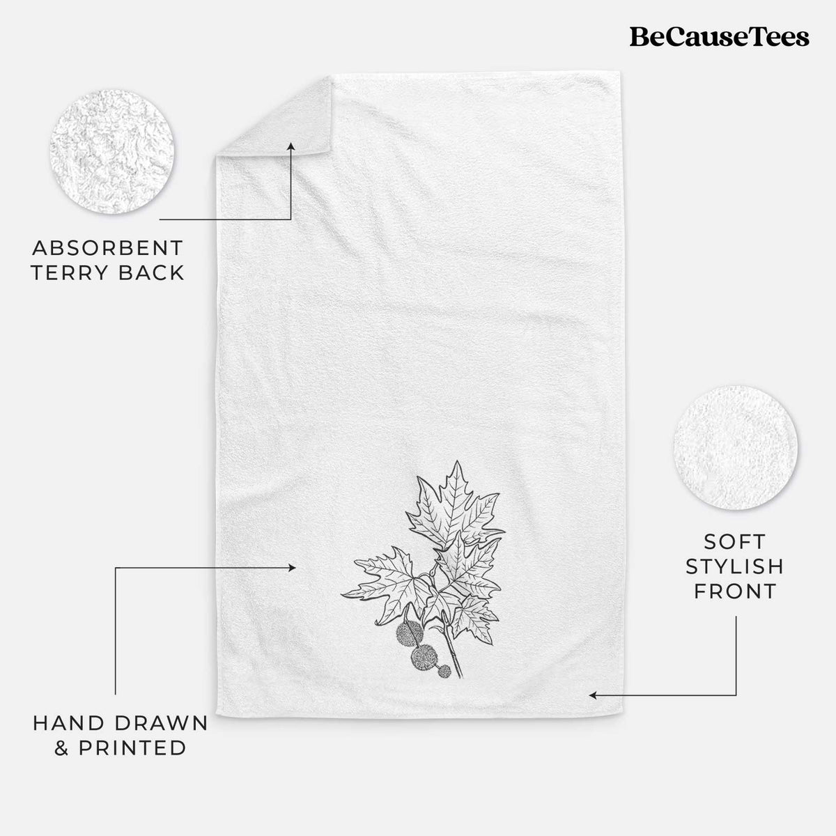 White hand towel printed with a black ink illustration of an oriental plane tree branch with lobed leaves and round seed balls.