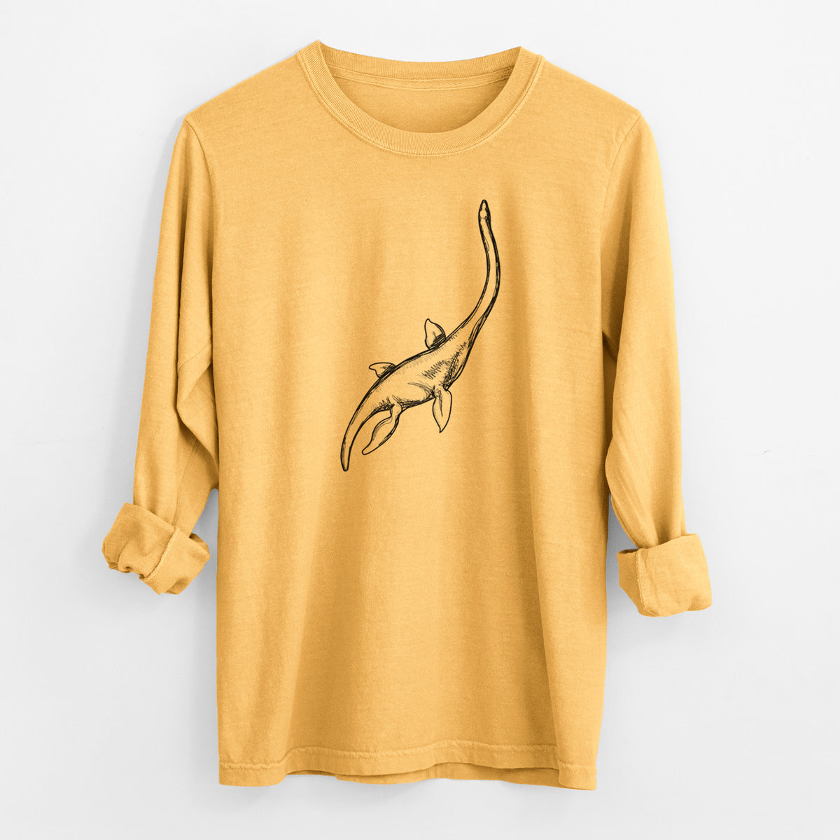 Golden wheat yellow Comfort Colors long sleeve shirt laid flat with the cuffs rolled, printed with a black ink illustration of a long-necked plesiosaur swimming.