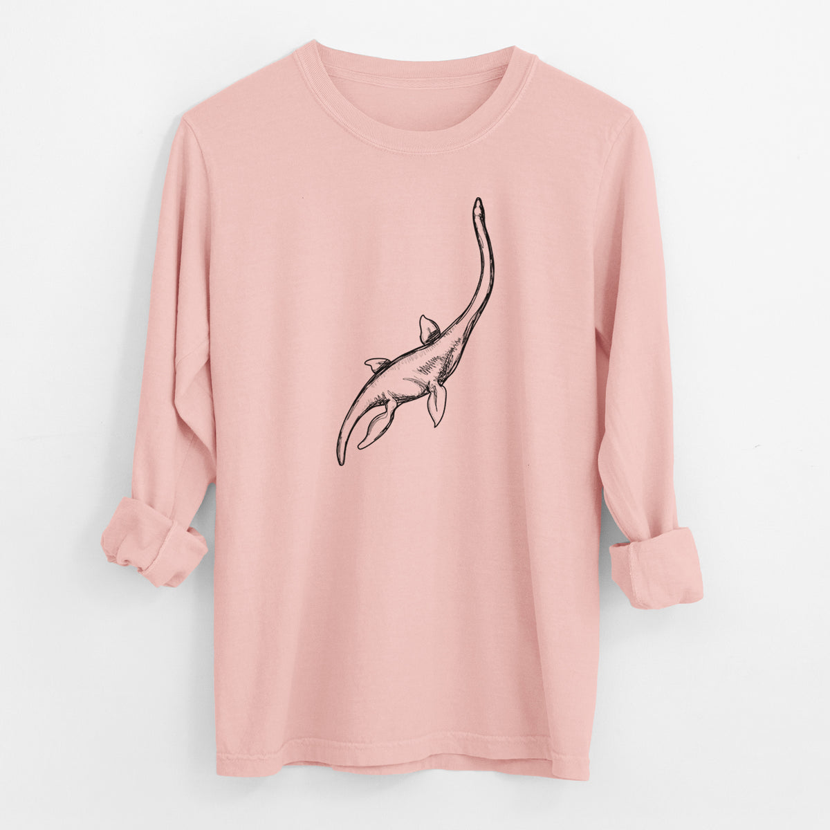 Peachy Comfort Colors long sleeve shirt laid flat with the cuffs rolled, printed with a black ink illustration of a long-necked plesiosaur swimming.