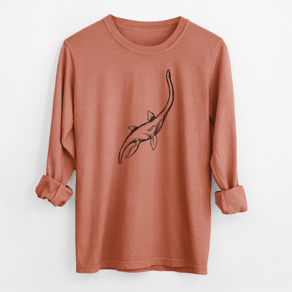Yam burnt orange Comfort Colors long sleeve shirt laid flat with the cuffs rolled, printed with a black ink illustration of a long-necked plesiosaur swimming.