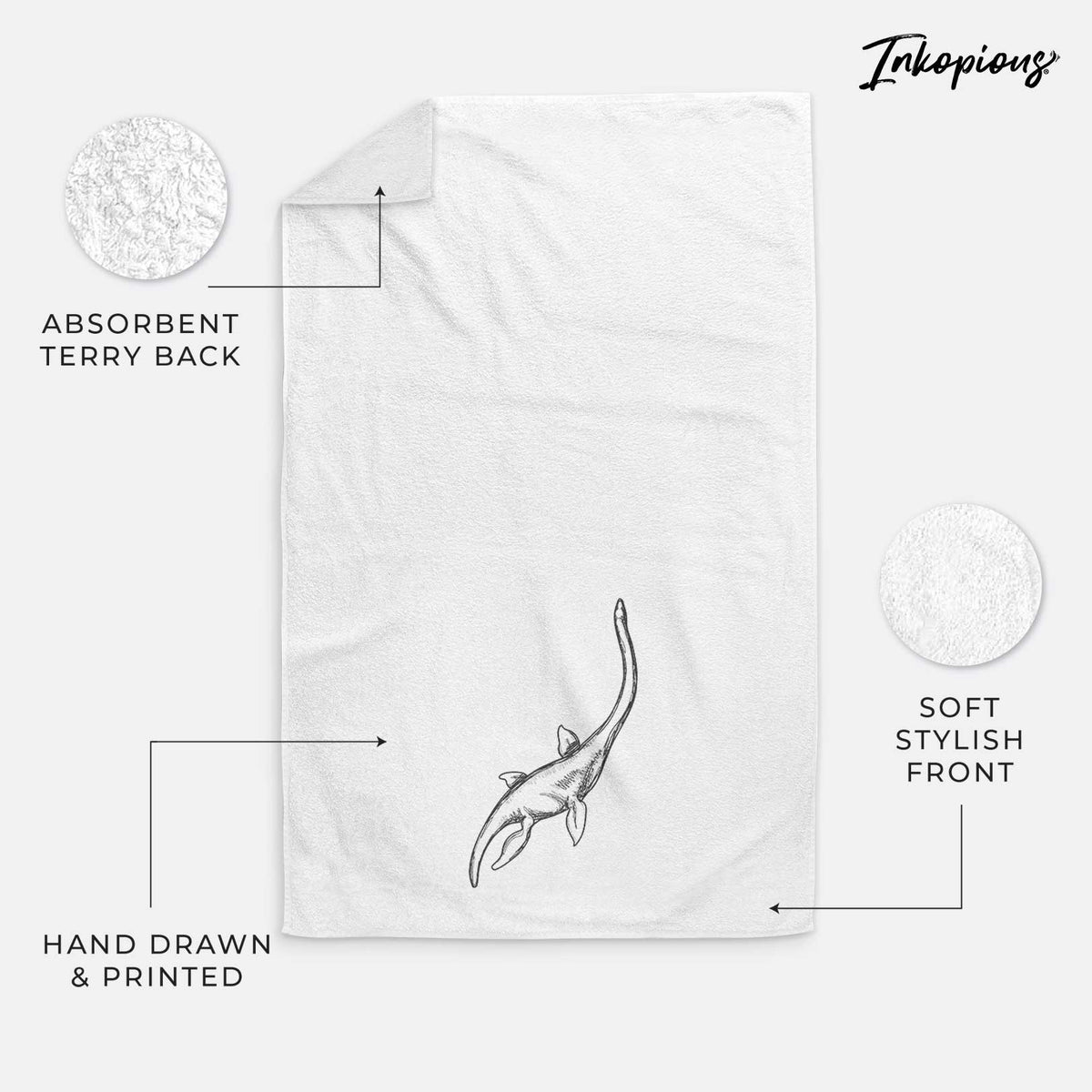 White hand towel printed with a black ink illustration of a long-necked plesiosaur swimming.
