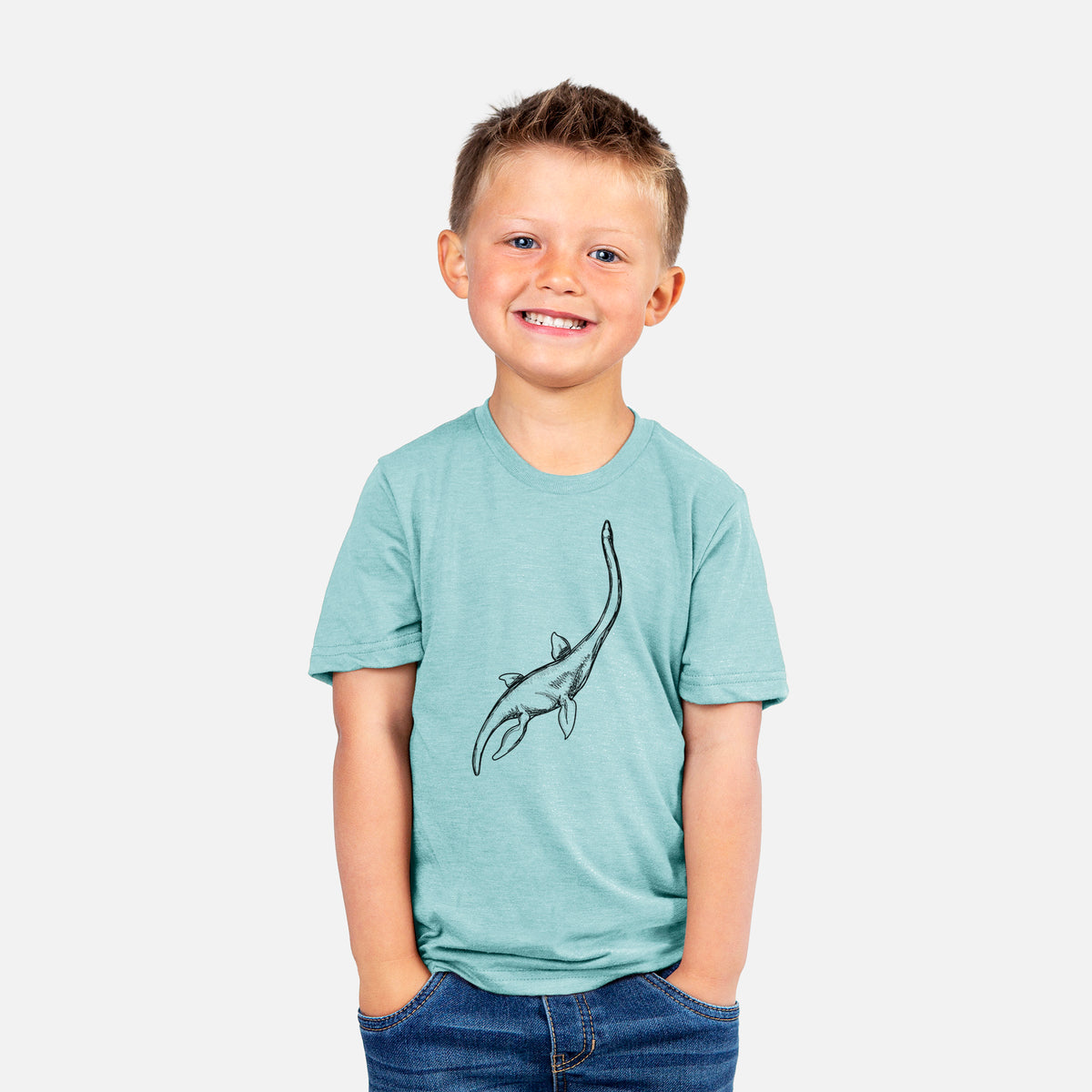 Smiling boy wearing a youth t-shirt printed with a black ink illustration of a long-necked plesiosaur swimming.