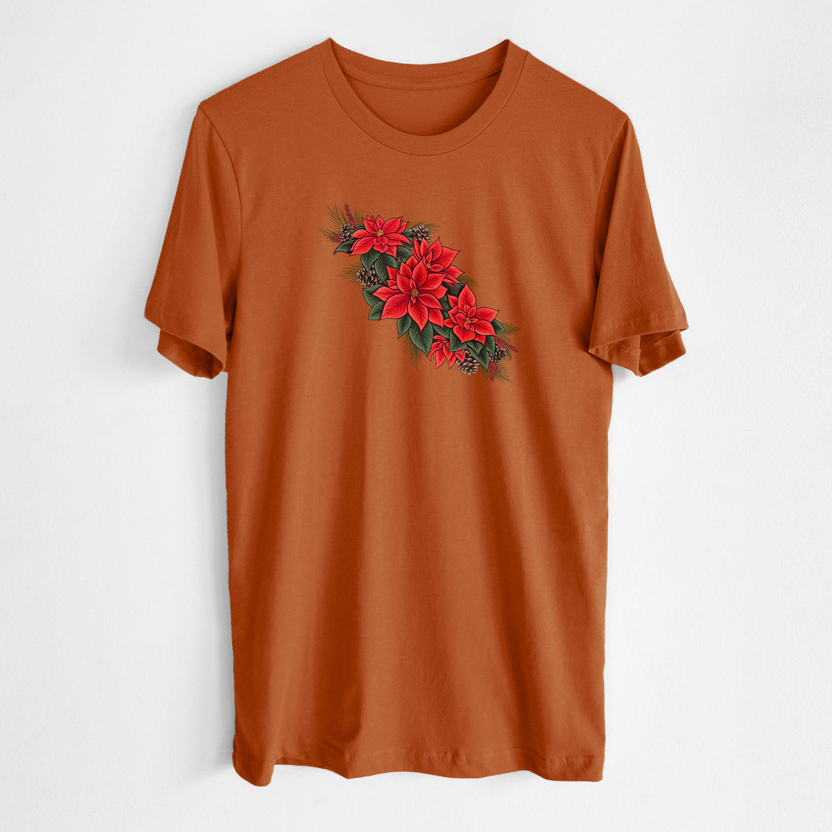 Autumn lightweight cotton t-shirt laid flat, printed with a full-color illustration of red poinsettia flowers with pine greenery and pine cones.
