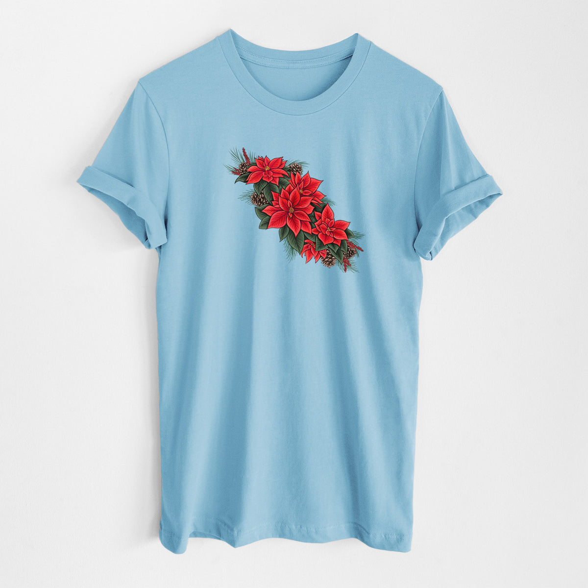 Ocean blue lightweight cotton t-shirt laid flat, printed with a full-color illustration of red poinsettia flowers with pine greenery and pine cones.
