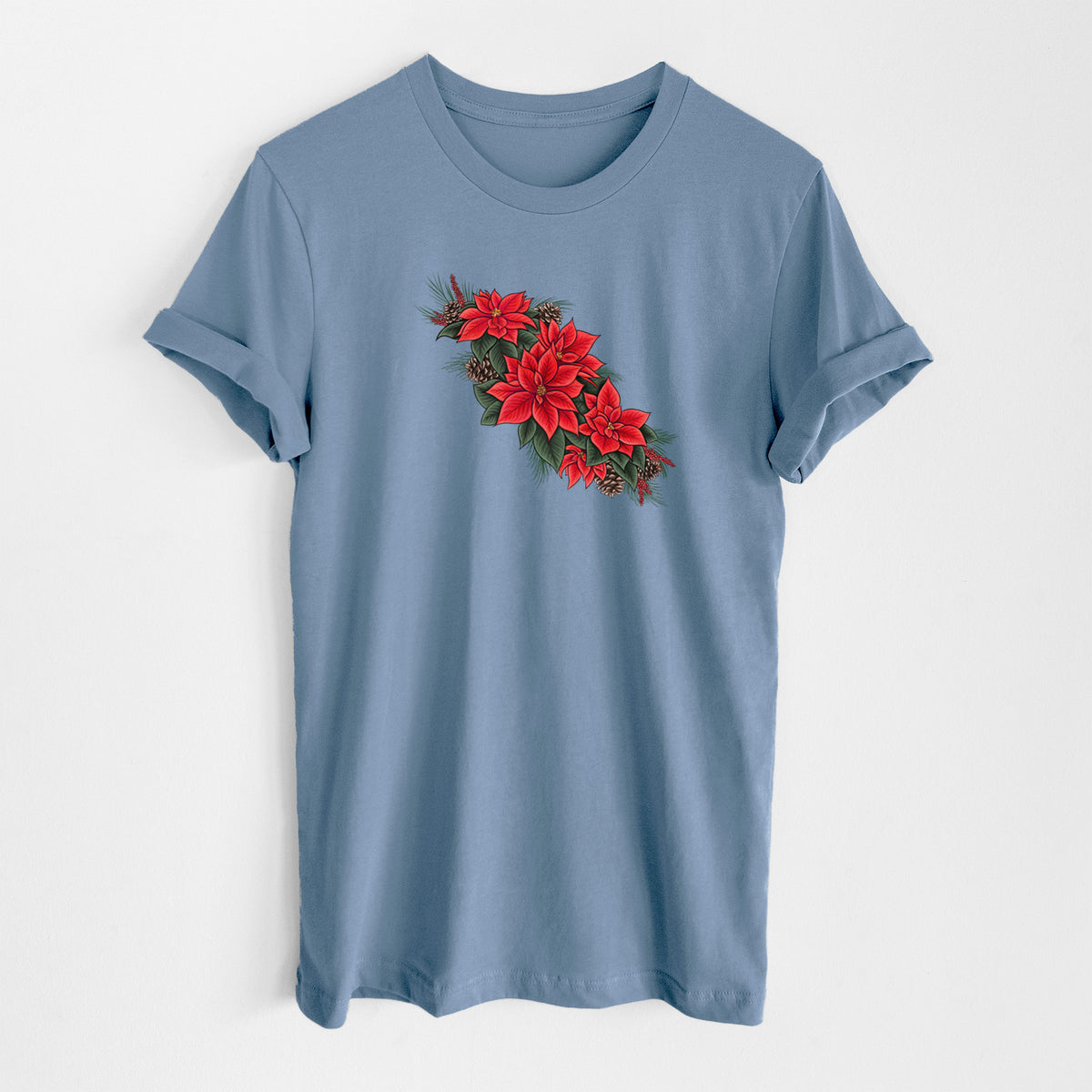 Steel blue lightweight cotton t-shirt laid flat, printed with a full-color illustration of red poinsettia flowers with pine greenery and pine cones.
